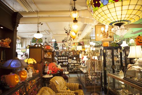 The image is of Carriage Town Antiques. There are multiple timeless vintage nick-nacks found in this antique shop.